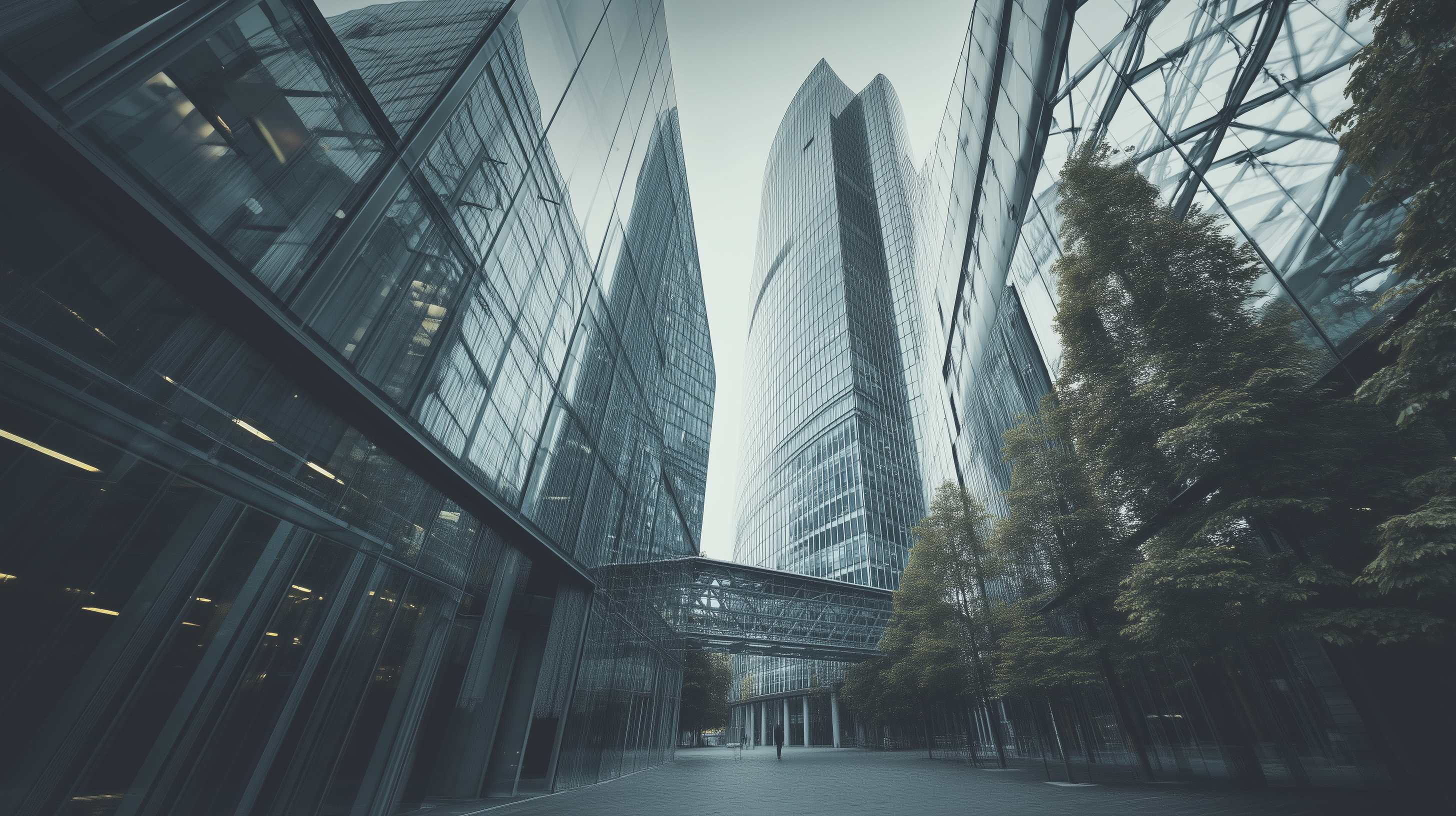 Modern glass buildings with trees, representing growth and development